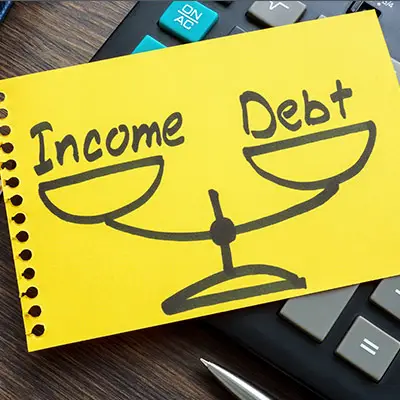 Image of drawing of scale with DEBT and INCOME being balanced