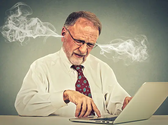 Image of stressed man with smoke coming out of his ears