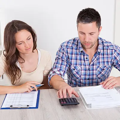 Image of couple calculating expenses